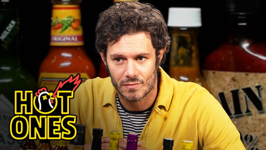 Adam Brody Surfs Through the Pain While Eating Spicy Wings