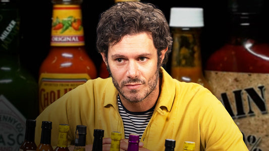 Adam Brody Surfs Through the Pain While Eating Spicy Wings