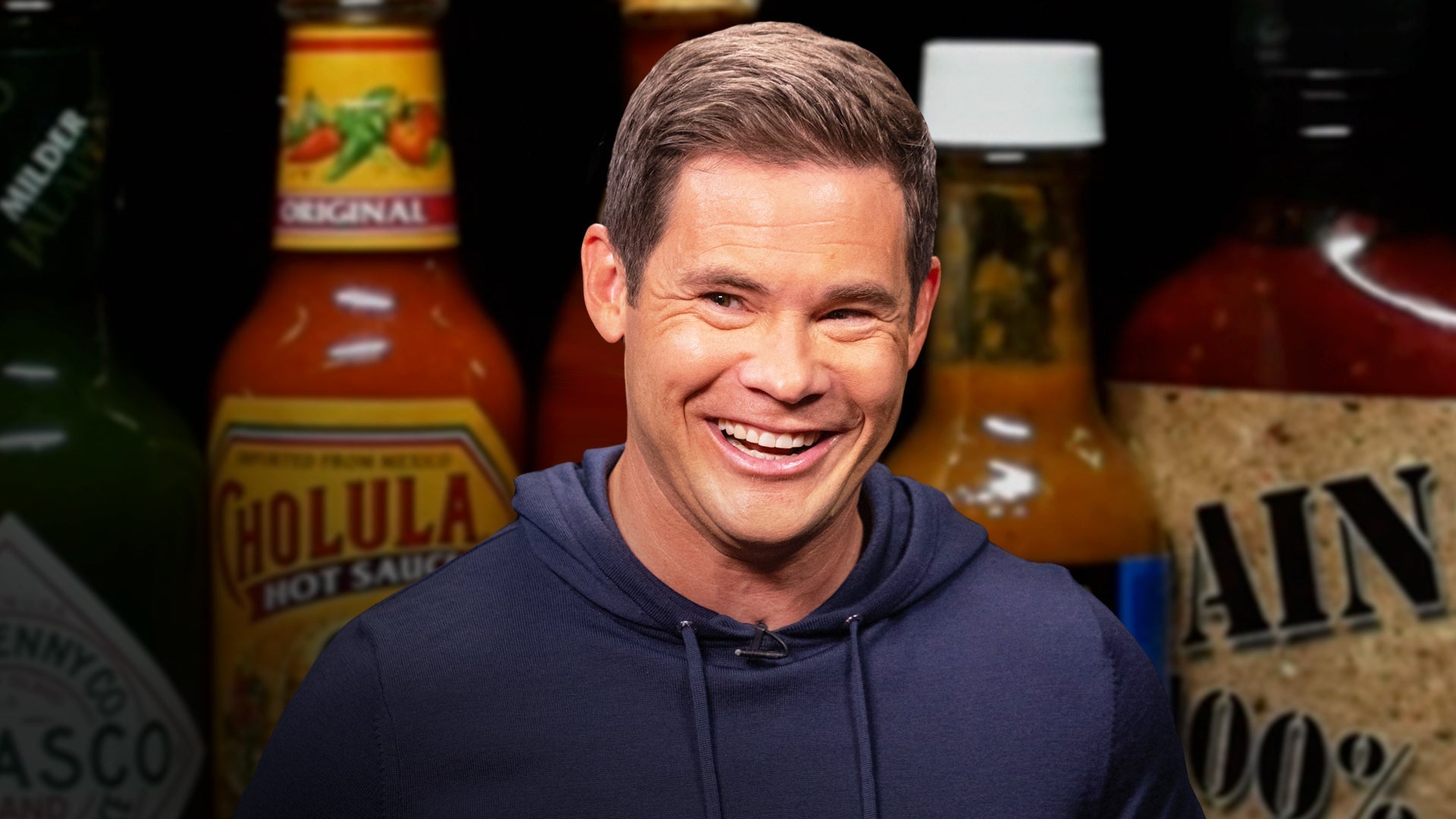 Adam Devine Shocks a Live Audience While Eating Spicy Wings